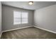 Cozy bedroom features neutral tones, carpeted floors, and a window allowing natural light at 4204 Hardy Ave, Smyrna, GA 30082