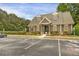 Community clubhouse featuring ample parking and well-manicured landscaping at 4204 Hardy Ave, Smyrna, GA 30082