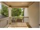 Inviting covered deck offers a serene outdoor space with wooden floors and views of the surrounding greenery at 4204 Hardy Ave, Smyrna, GA 30082