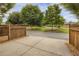 Open driveway showing partial fence and tree-lined street at 4204 Hardy Ave, Smyrna, GA 30082