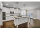 Modern kitchen with white cabinets, granite countertops, and stainless steel appliances at 4204 Hardy Ave, Smyrna, GA 30082