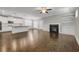 Open concept living and kitchen area featuring stainless appliances and a fireplace at 4204 Hardy Ave, Smyrna, GA 30082