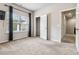 Empty bedroom features a window with curtains and access to the closet at 6094 Whitetail Deer Run, Mableton, GA 30126