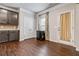 Cozy dining area with hardwood floors, a window, and views of the kitchen at 6094 Whitetail Deer Run, Mableton, GA 30126