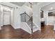 Inviting foyer with hardwood floors, staircase, and a view of the kitchen at 6094 Whitetail Deer Run, Mableton, GA 30126
