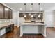 Modern kitchen with granite countertops, stainless steel appliances, and pendant lighting at 6094 Whitetail Deer Run, Mableton, GA 30126