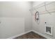 Unfinished laundry room with vinyl floor and white wire shelving at 6094 Whitetail Deer Run, Mableton, GA 30126