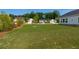 Beautiful backyard featuring a lush green lawn and well-maintained landscaping at 740 Pineberry Ct, Grayson, GA 30017