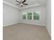 Bedroom with tray ceiling and carpet at 740 Pineberry Ct, Grayson, GA 30017