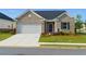 Charming single-story brick home featuring an attached two-car garage and well-manicured front lawn at 740 Pineberry Ct, Grayson, GA 30017