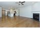 Spacious living room with hardwood floors, fireplace, and open to kitchen at 740 Pineberry Ct, Grayson, GA 30017