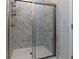 Modern shower with marble tile at 740 Pineberry Ct, Grayson, GA 30017