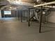 Spacious unfinished basement with exposed pipes and support beams, offering potential at 1093 Hasty Sw Ct, Lilburn, GA 30047