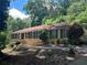 Charming single-story home features a manicured lawn and classic brick facade at 1093 Hasty Sw Ct, Lilburn, GA 30047