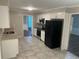 Well-lit kitchen with granite countertops and stainless steel appliances at 1093 Hasty Sw Ct, Lilburn, GA 30047
