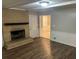 Inviting living room featuring a brick fireplace and sleek flooring at 1093 Hasty Sw Ct, Lilburn, GA 30047