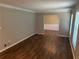 The living room features sleek flooring and crown moulding details at 1093 Hasty Sw Ct, Lilburn, GA 30047