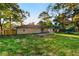 A spacious backyard with a patio and green grass at 1770 Atherton Dr, Decatur, GA 30035