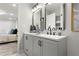 Bathroom with double vanity, granite countertop, and access to bedroom at 1770 Atherton Dr, Decatur, GA 30035