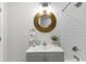 This bathroom features a round mirror, granite sink and shower-tub at 1770 Atherton Dr, Decatur, GA 30035