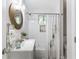 The bathroom has a shower-tub, white tile and gray vanity at 1770 Atherton Dr, Decatur, GA 30035