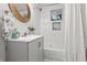 Bathroom with modern vanity, sleek mirror, and bathtub at 1770 Atherton Dr, Decatur, GA 30035