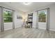 Bright bedroom with wood-look flooring and modern decor near the windows at 1770 Atherton Dr, Decatur, GA 30035