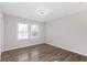 This bedroom features lots of natural light, wood floors, and a ceiling fan at 1770 Atherton Dr, Decatur, GA 30035