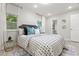 Well lit bedroom featuring stylish decor, modern artwork and wood-look flooring at 1770 Atherton Dr, Decatur, GA 30035