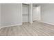 Bedroom with wood-look floors, walk-in closet, and neutral paint at 1770 Atherton Dr, Decatur, GA 30035