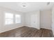 This bedroom features lots of natural light, wood floors, and a ceiling fan at 1770 Atherton Dr, Decatur, GA 30035