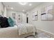 Spacious bedroom boasts with stylish decor, modern art and wood-look flooring at 1770 Atherton Dr, Decatur, GA 30035