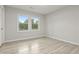 Bedroom with wood-look flooring, natural light, and neutral tones at 1770 Atherton Dr, Decatur, GA 30035