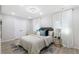 Bright bedroom with a patterned accent wall, decorative pillows, and sheer curtains for an airy feel at 1770 Atherton Dr, Decatur, GA 30035