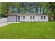 Charming single-story home with a well-manicured lawn and freshly painted white brick at 1770 Atherton Dr, Decatur, GA 30035