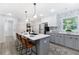 Modern kitchen featuring stainless appliances, quartz countertops, and a stylish island with seating at 1770 Atherton Dr, Decatur, GA 30035