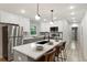 Modern kitchen features a large island with seating, stainless steel appliances, and gray cabinetry at 1770 Atherton Dr, Decatur, GA 30035