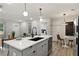 Bright and open kitchen featuring an island with bar seating, a breakfast area, and an open layout at 1770 Atherton Dr, Decatur, GA 30035