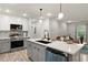 Modern kitchen features stainless appliances, island, and stylish white and gray cabinetry at 1770 Atherton Dr, Decatur, GA 30035