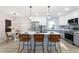 Modern kitchen with stainless steel appliances, quartz countertops, and a stylish breakfast bar at 1770 Atherton Dr, Decatur, GA 30035