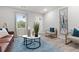 Bright living room featuring contemporary furniture, a large window, and decorative wall art at 1770 Atherton Dr, Decatur, GA 30035