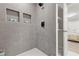 Walk-in shower features tiled walls, inset shelving, and modern fixtures at 1770 Atherton Dr, Decatur, GA 30035