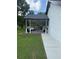 Outdoor space with covered patio featuring dining & seating areas plus a grilling area for entertaining at 2303 Condor Dr, Lawrenceville, GA 30044