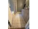 Bathroom features updated vanity, gray walls, tile flooring, and a tub/shower with glass doors at 2303 Condor Dr, Lawrenceville, GA 30044