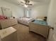 Bedroom featuring two beds, dresser, and natural light at 2303 Condor Dr, Lawrenceville, GA 30044
