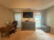 Bedroom with a TV, dresser, desk, and natural light at 2303 Condor Dr, Lawrenceville, GA 30044