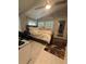 Cozy bedroom with white tile flooring, a ceiling fan, a comfy bed, and a quirky Spider-Personal rug at 2303 Condor Dr, Lawrenceville, GA 30044