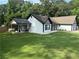 Charming home with covered porch, new roof, and well-maintained lawn at 2303 Condor Dr, Lawrenceville, GA 30044