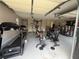 Spacious garage converted to a gym with a variety of fitness equipment and ample workout space at 2303 Condor Dr, Lawrenceville, GA 30044