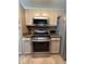 Well-maintained kitchen featuring stainless steel appliances and ample cabinet space at 2303 Condor Dr, Lawrenceville, GA 30044